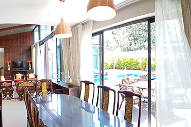 Dining and Living Area with Garden and Pool View